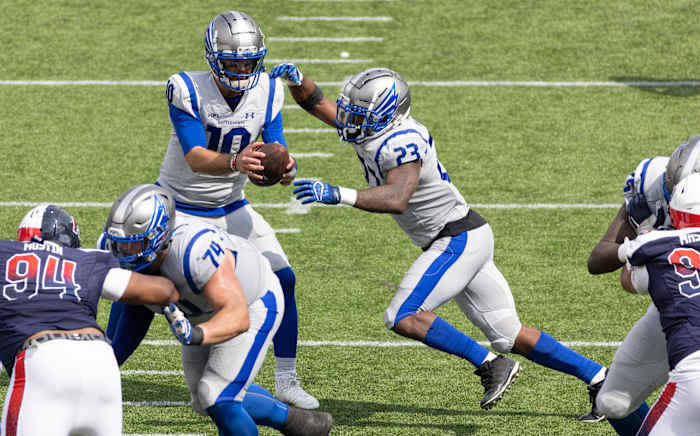 Apr 2, 2023; Houston, TX, USA; Louis Battlehawks quarterback A.J. McCarron (10) fakes the hand off to running back Brian Hill (23) against the Houston Roughnecks in the fourth quarter at TDECU Stadium. Mandatory Credit: Thomas Shea-USA TODAY Sports